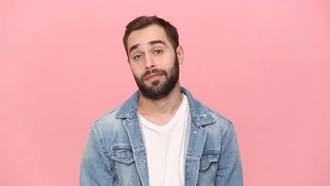 Young guy 20s years old in denim jacket white t-shirt showing blah blah gesture Stock Footage 136324495