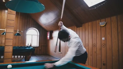 Young guy is angry playing billiards Stock Footage 81476700