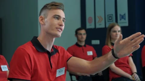 Young guy asks a question of a speaker during a continuing education lecture Stock Footage 159806250