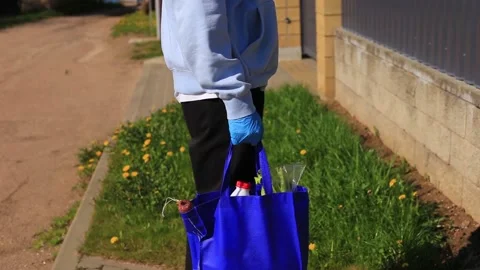 Young guy with a bag of products in his hands. Stock Footage 130319908