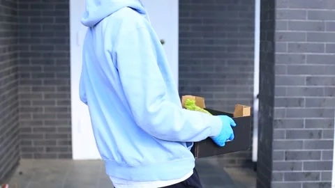 Young guy with a bag of products in his hands. Stock Footage 130319934
