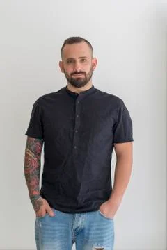 Young guy with beard and black hair outlined on a white background Stock Photos
