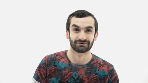 Young guy with a beard cleans his ears with a cotton swab Stock Footage 107433282