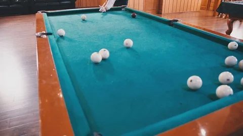 Young guy beats a cue on the ball Stock Footage 81543987