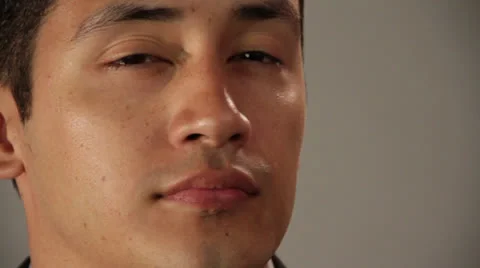 A young guy bends his mind from left to straight and smiles Stock Footage 22825752