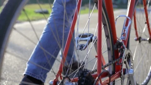 A young guy with a bicycle goes 스톡 동영상 74089576