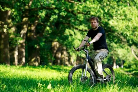 Young guy on bike Stockfoto's