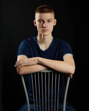 Young guy on a black background Stock Photos