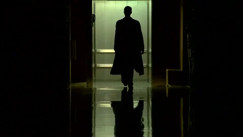 A young guy in a black long coat enters the elevator Stock Footage 274695332