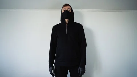 A young guy in black shows a cool hand gesture. White background Vidéo 129555687