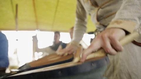 Young guy blowing out blacksmith's fur Stock Footage 82357401