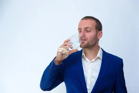 A young guy in a blue jacket is a duplicate of Hollywood actor Woody Harrelso Stock Photos