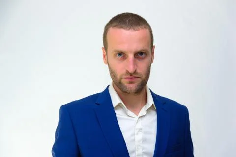 A young guy in a blue jacket is a duplicate of Hollywood actor Woody Harrelso Stock Photos