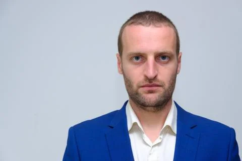 A young guy in a blue jacket is a duplicate of Hollywood actor Woody Harrelso Stock Photos