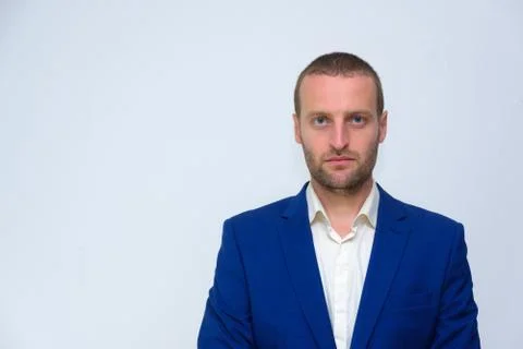 A young guy in a blue jacket is a duplicate of Hollywood actor Woody Harrelso Stock Photos