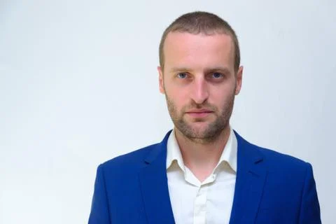 A young guy in a blue jacket is a duplicate of Hollywood actor Woody Harrelso Stock Photos