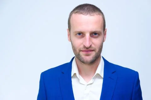 A young guy in a blue jacket is a duplicate of Hollywood actor Woody Harrelso Stock Photos