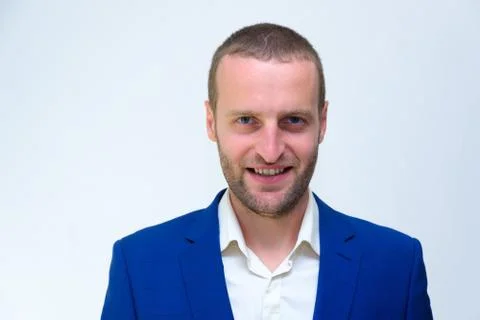 A young guy in a blue jacket is a duplicate of Hollywood actor Woody Harrelso Stock Photos