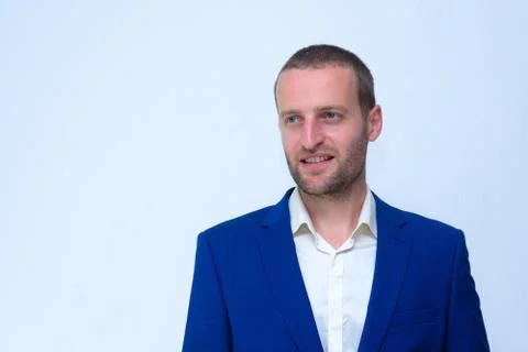 A young guy in a blue jacket is a duplicate of Hollywood actor Woody Harrelso Stock Photos