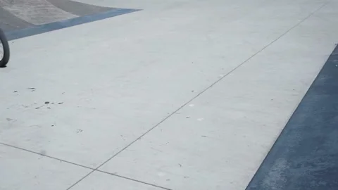 Young guy on bmx performs trick on springboard Stock Footage 102538639