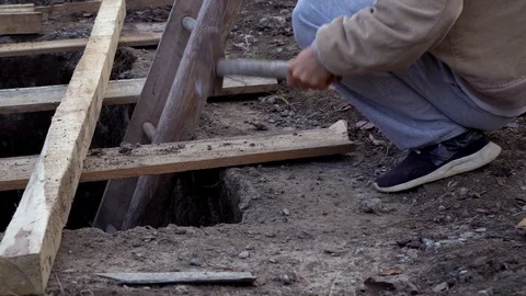 Young guy breaks concrete with a big hammer.closeup Stock Footage 120253349
