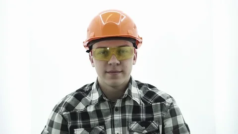 Young guy in a builder costume smiling and showing thumbs up Stock Footage 107008763
