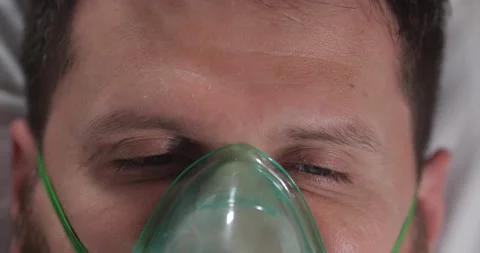 Young guy closing his eyes in a hospital bed Stock Footage 166728239