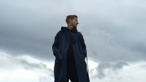 Young Guy On Cloudy Sky Background. Video stock 125724312