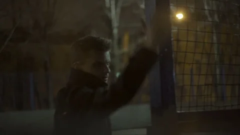 Young guy in a coat makes sharp movements Video stock 77377474