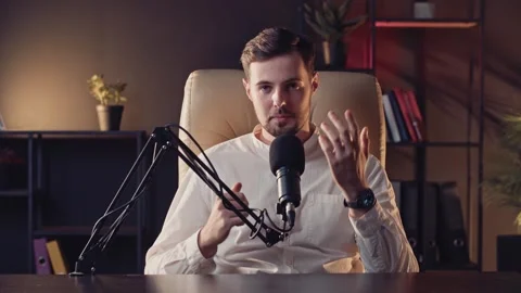 Young guy content creator recording new video. Live stream broadcast of Stock Footage 256320932