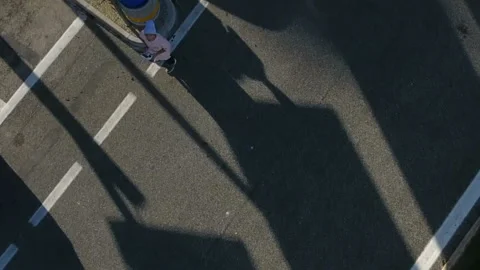 Young guy control a drone in the parking lot 스톡 동영상 102093553