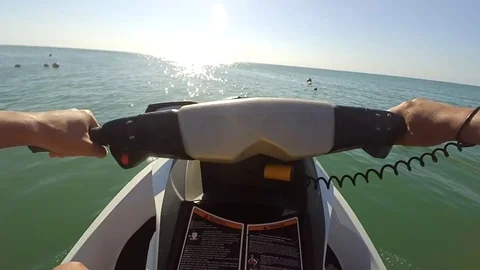 Young guy cruising on a jet ski on the sea Stock Footage 71828292