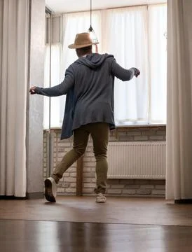 Young guy dancer in motion in a pose. A man performs a modern dance in casu.. Stock Photos