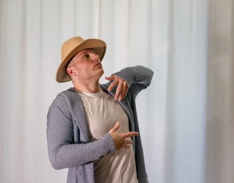 Young guy dancer in motion in a pose. A man performs a modern dance in casu.. Stock Photos