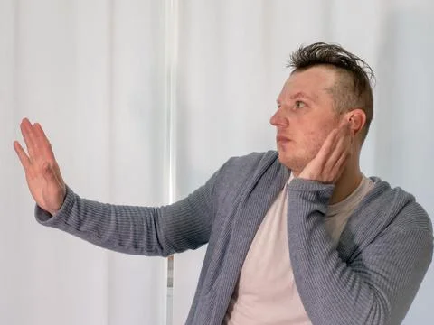 Young guy dancer in motion in a pose. A man performs a modern dance in casu.. Stock Photos