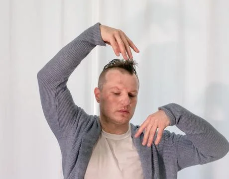 Young guy dancer in motion in a pose. A man performs a modern dance in casu.. Stock Photos