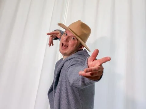 Young guy dancer in motion in a pose. A man performs a modern dance in casu.. Stock Photos