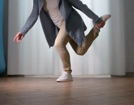 Young guy dancer in motion in a pose. A man performs a modern dance in casu.. Stock Photos