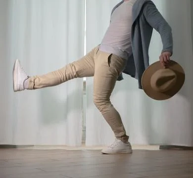 Young guy dancer in motion in a pose. A man performs a modern dance in casu.. Stock Photos
