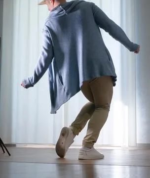 Young guy dancer in motion in a pose. A man performs a modern dance in casu.. Stock Photos