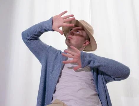 Young guy dancer in motion in a pose. A man performs a modern dance in casu.. Photos