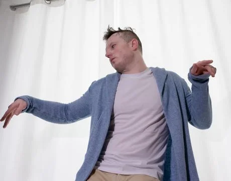 Young guy dancer in motion in a pose. A man performs a modern dance in casu.. Stock Photos