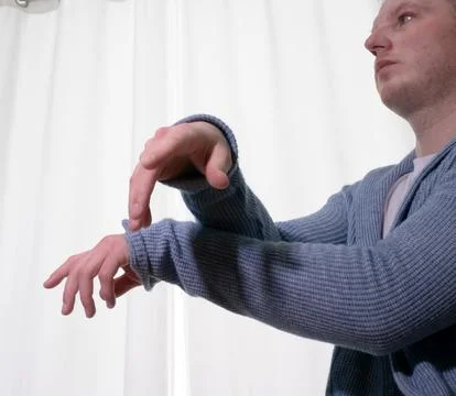 Young guy dancer in motion in a pose. A man performs a modern dance in casu.. Stock Photos