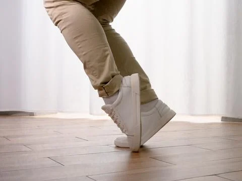 Young guy dancer in motion in a pose. A man performs a modern dance in casu.. Stock Photos
