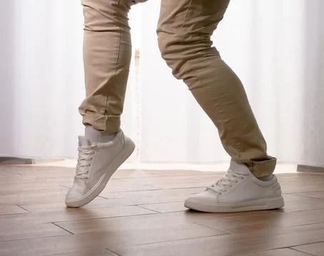 Young guy dancer in motion in a pose. A man performs a modern dance in casu.. Stock Photos