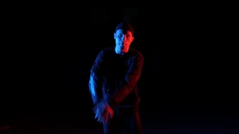 Young guy dancing break dance, hip hop, street dancing in the studio, isolated Stock Footage 121515113