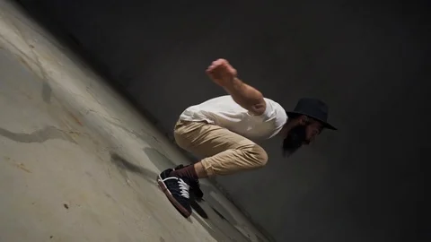 Young guy dancing break, urban style street breakdancing concept. Dancer jumps Stock Footage 119634532