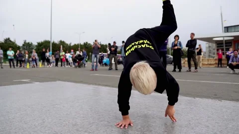 A young guy is dancing breakdance at the festival Stock Footage 170064359