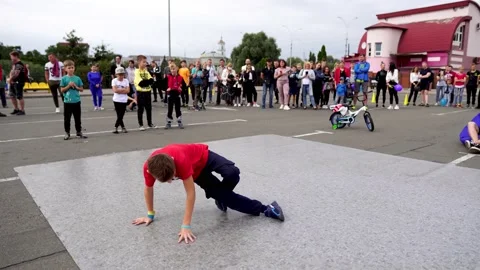 A young guy is dancing breakdance at the festival Stock Footage 170064363