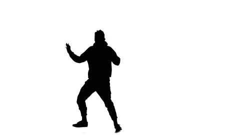 Young guy dancing hip hop, freestyle, street dance, slow motion, silhouette Stock Footage 130335457